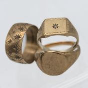 A 9ct gold signet ring set with a diamond, together with another signet ring and a star cut