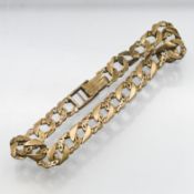 A 9ct gold curb link bracelet with bark effect decoration, approx 12.6g.