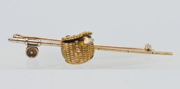 A rare 9ct gold fishing brooch.