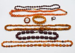 A mixed collection of amber bead necklaces and bracelets.