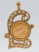 A 1915 gold half-sovereign in a 9ct ornate pendant mount, approx 10g.