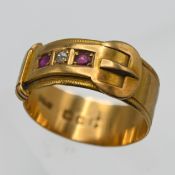 An 18ct ruby and diamond set buckle ring, approx 4.40g, size N.