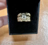 An 18ct three piece diamond set trilogy ring, approx 10.30g, size N.