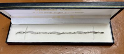 An 9ct white gold bracelet, approx 8.3g.