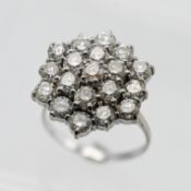 An 18ct diamond cluster ring, with a three tier cluster formation set with nineteen modern brilliant