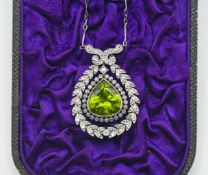 An antique and diamond peridot pendant on chain.