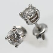 Tiffany & Co, a pair of diamond stud earrings with formal Tiffany certificate, each diamond 0.