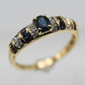 A 14ct diamond and sapphire ring, size O.