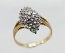 A yellow gold diamond cluster ring, with abstract claw set design, size V.
