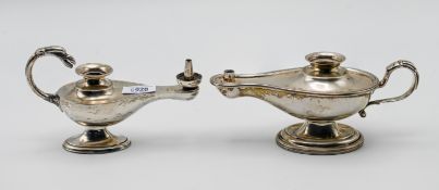 Two silver oil lamps, one handle in the form of a bird, hallmarked London 1930, the other Birmingham