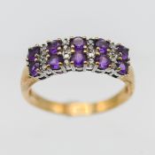 A 9ct gold Amethyst ring, set with 10 amethysts.