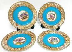 A set of four 19th/20th century Meissen gilt blue plates, with floral imagery and pierced rim,