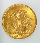 A George V 1913 gold full Sovereign.