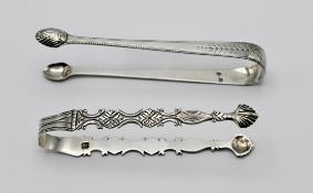 A pair of Georgian silver sugar tongs, hallmarked, maker T.H I.C Thomas Hannam and John Carter,