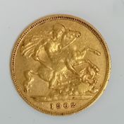 An Edward VII 1902 gold half Sovereign.