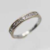 An 18ct white gold diamond eternity ring set with eleven princess cut diamonds, approx 0.50ct,