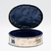 An Edwardian silver pin cushion box, with green velvet lid, hallmarked Birmingham 1909.