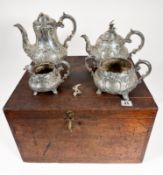 A mid Victorian foliate design silver tea service, comprising of coffee pot (slight damage to
