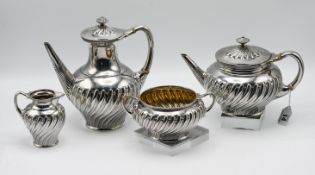 A Victorian silver tea set, consisting of a teapot and coffeepot with ivory insulators, milk jug,