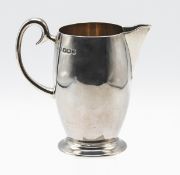 A George V silver cream jug, hallmarked Sheffield 1930, maker Lee and Wigfull, silver weight 2.
