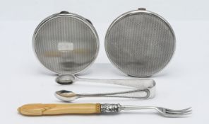 Two silver compacts, together with a pair of sugar tongs, hallmarked Sheffield 1909, and a silver