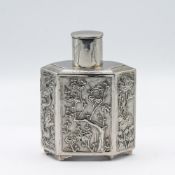 A 19th/20th century Chinese silver tea caddy, decorated with embossed dragons and foliate imagery,
