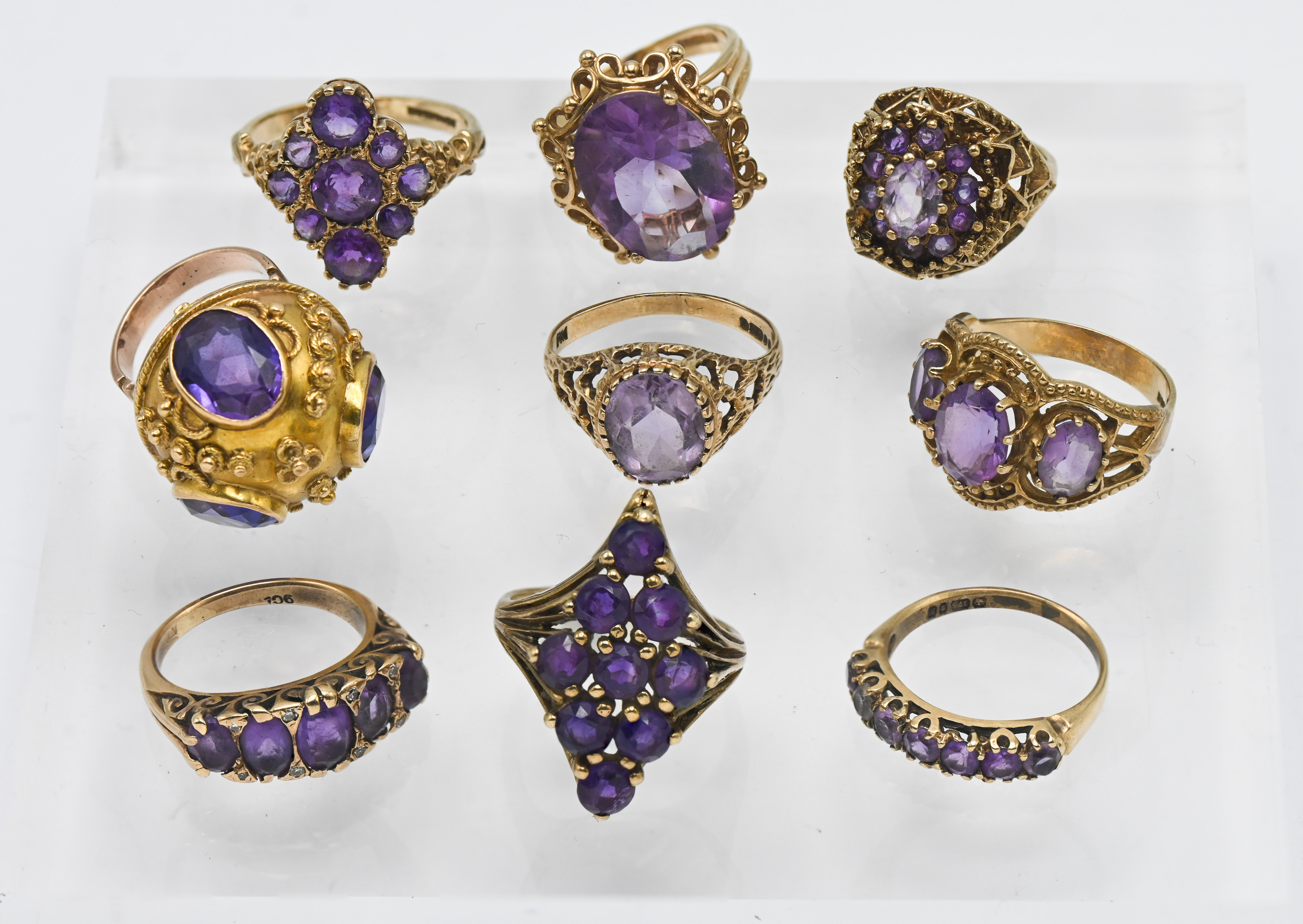 Nine 9ct gold rings set with amethysts, overall weight 44.4g.