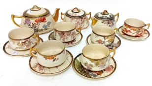 An early 20th century Japanese Taisho period Satsuma tea set, of floral and bird decoration