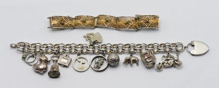 A white metal charm bracelet, with silver padlock charm, together with another bracelet (2)