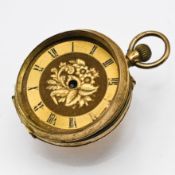 An 18ct ladies fob pocket watch with engraved foliate design (dial loose, missing hands and