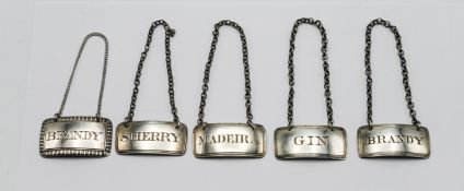 Five early 19th century silver decanter labels, various makers and dates, with chains, largest