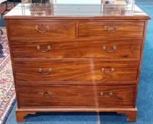 A George III mahogany chest of drawers, with bracket feet.
