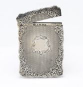 A Victorian silver card case with engraved foliate design, hallmarked Birmingham 1872, maker