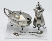A silver mustard pot and pepper (damaged foot), hallmarked Sheffield 1947, together with two mustard