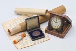A quantity of various items, to include an 8 day folding travelling clock in wooden case, a