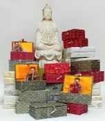 A Chinese reproduction blanc de chine figure in an upholstered box, together with a collection of