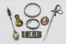 A collection of seven assorted items, including a silver christening bracelet hallmarked Chester