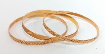 Three Iranian? Gold bangles, marked 'ZAMAB SANIEE 720', total weight 22g. (3)
