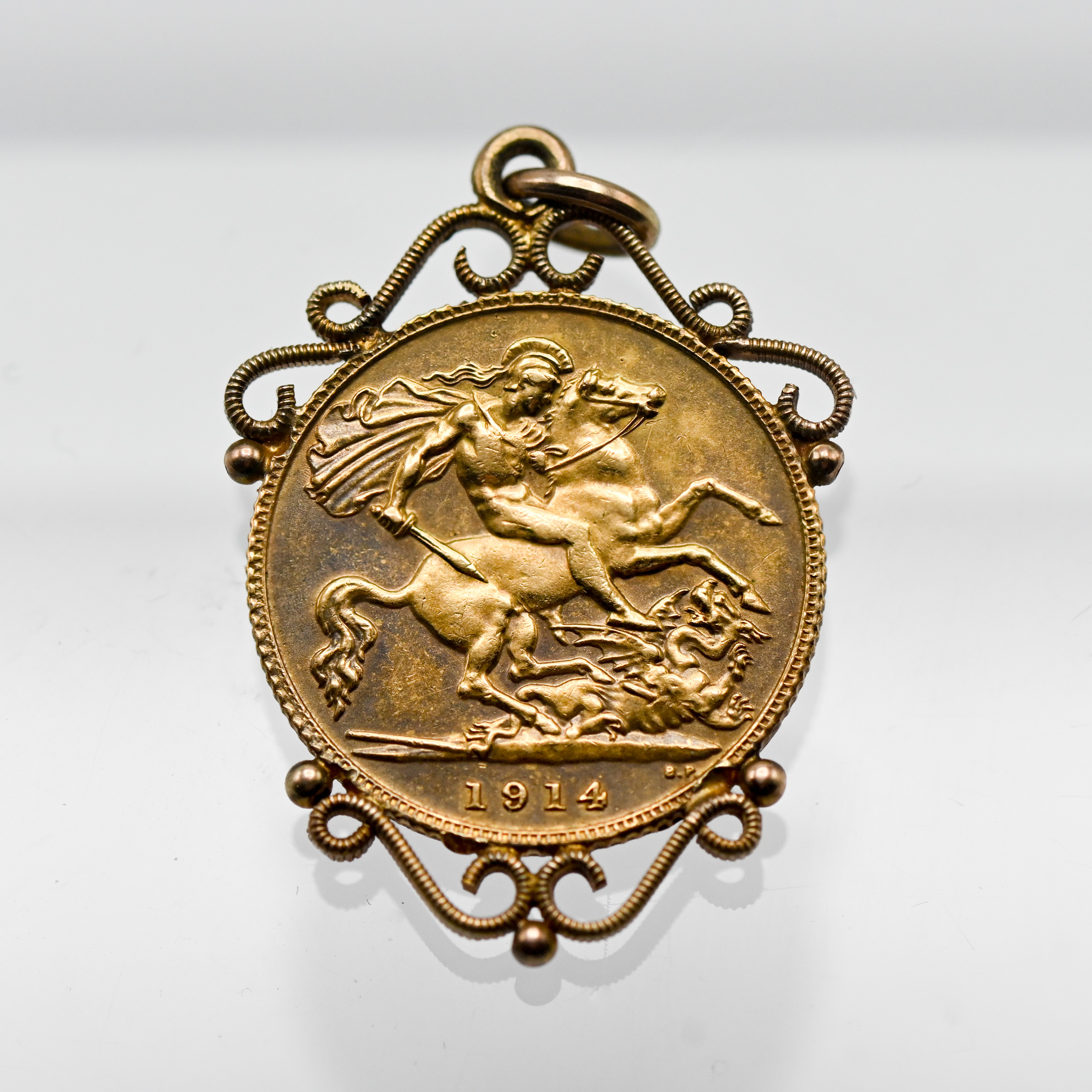 A George V 1914 gold Half Sovereign, mounted on a pendant, weight 4.8g.