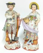 A pair of figures, depicting a man and woman in 18th century peasant dress, floral motifs, slashed