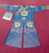 An embroidered blue gauze mandarin dragon robe, Chinese, decorated with seven five-clawed dragons