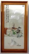 A framed Chinese embroidery of a calligrapher as ease with two ducks and Chinese script, overall