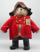 A Gabrielle design Paddington Bear, with label to back seam, a red duffel coat, brown hat and