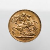 A George V 1911 gold full Sovereign.