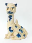 An Aller Vale, Devon ceramic cat with inset glass eyes and elongated neck, blue and white glaze,