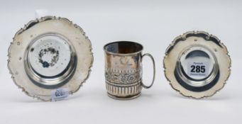 Two small silver saucers, hallmarked Sheffield 1996-97, together with a Victorian silver mug,