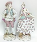 A large pair of probably Meissen figures, depicting a wealthy man and woman in 18th century dress,