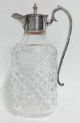 A cut glass and silver plate mounted claret jug with inscription, height 29cm.