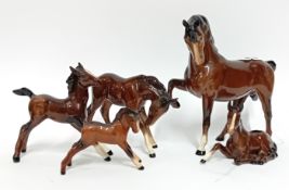 Five Beswick horse figurines, to include one larger horse and four foals. (5)