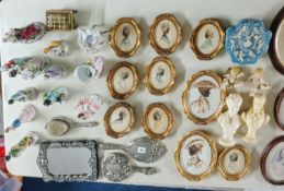 12 'Christine Silver Original Silhouette' photographs, in addition to an ornate mirror and brush set